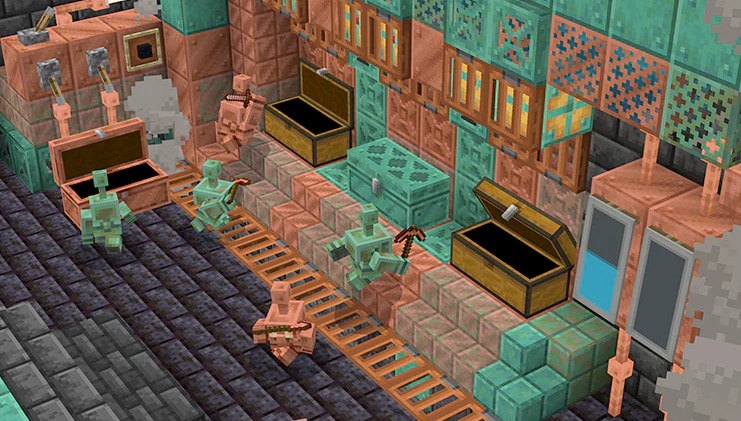 Widok z góry na grupę miedzianych Golemów, ciężko pracujących przy sortowaniu dwóch dużych skrzyń.